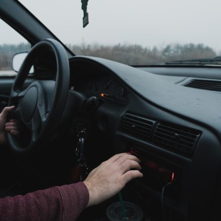 person driving black car