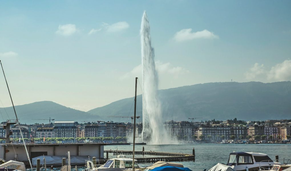 water fountain near city buildings during daytime