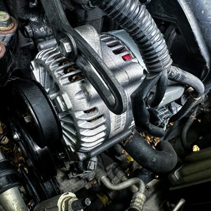 a car engine with a black hood